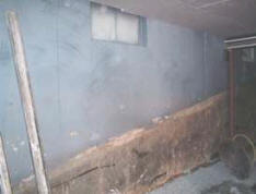 Window in a concrete wall before cutting the door.